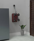 Tow Behind Wall Mount Bracket Kit For Lawn Care Attachments Space Saving Garage Organizer Keeps Mowers Spreaders And Other Tow Behind Tools Off The Floor And Ready To Grab, showing a wall-mounted bracket holding a red tow-behind spreader.