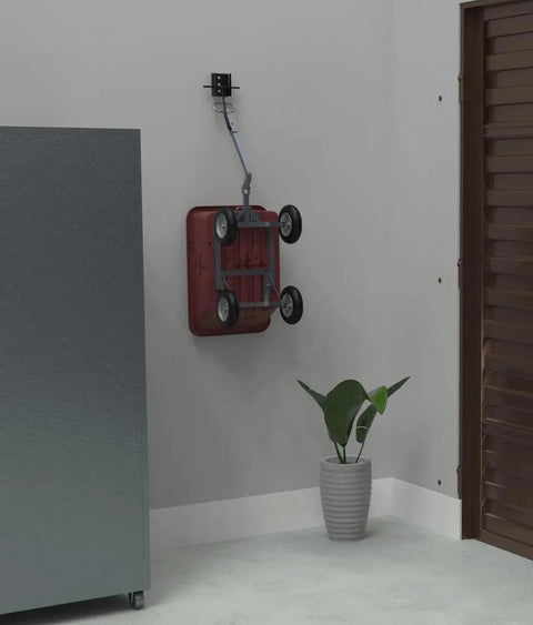 Tow Behind Wall Mount Bracket Kit For Lawn Care Attachments Space Saving Garage Organizer Keeps Mowers Spreaders And Other Tow Behind Tools Off The Floor And Ready To Grab, showing a wall-mounted bracket holding a red tow-behind spreader.