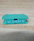 Heavy Duty Green Normally Open Contact Block Wno For 22Mm Pilot Devices With 10 Amp And 600 Vac Rating shown from the side.