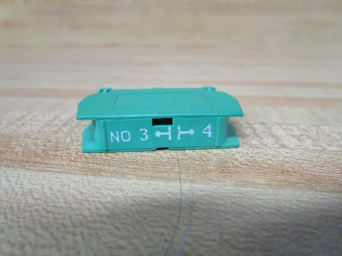 Heavy Duty Green Normally Open Contact Block Wno For 22Mm Pilot Devices With 10 Amp And 600 Vac Rating shown from the side.