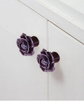 12 Pack Purple Rose Ceramic Knobs For Cabinets And Dressers Rose Flower Vintage Style Pulls shown on a white cupboard