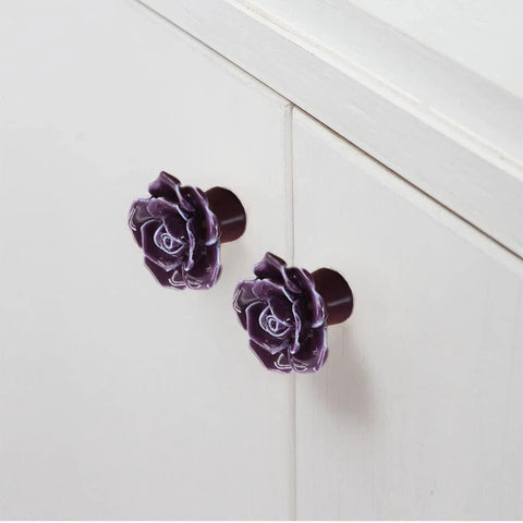 12 Pack Purple Rose Ceramic Knobs For Cabinets And Dressers Rose Flower Vintage Style Pulls shown on a white cupboard