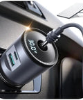Starlink Mini Car Power Adapter And 12V To 24V To 30V Dc Step Up Converter in vehicle socket with USB ports and digital display.