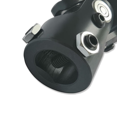 Close-up of 1 in DD black steel U joint for steering linkage, featuring needle bearing. Universal Steering U Joint 1 Inch DD X 1 Inch DD, 83mm Length.
