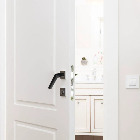 Black Aluminum Door Handle Replacement for bedroom, bathroom, and toilet doors on a white interior door, rust-resistant and waterproof