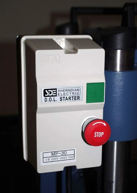 Shendrian Electric D.O.L Starter MP-30 with stop button, attached to a machine in a workshop setting.