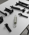Solid Build 3-5/8 Stainless Steel Recliner Mechanism Tension Spring With Long Neck Hook For Killer Glide Action And Bulletproof Furniture Repairs Today components on table.