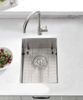 Top view of undermount 12 by 16 inch stainless steel bar sink with grid and faucet, ideal for wet bar and outdoor RV use, 16 gauge.