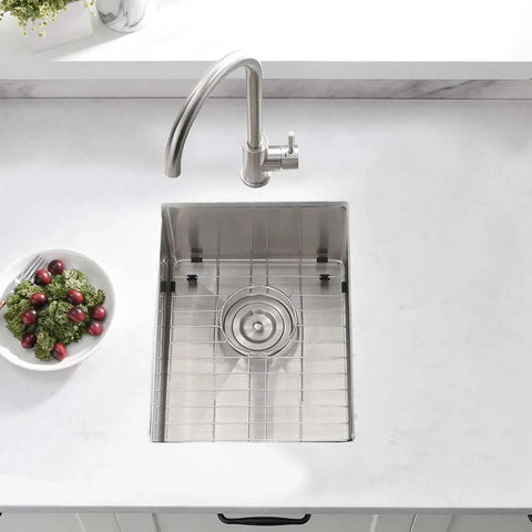 Top view of undermount 12 by 16 inch stainless steel bar sink with grid and faucet, ideal for wet bar and outdoor RV use, 16 gauge.
