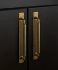 Antique Brass Cabinet Pulls With Backplates, Solid Zinc Alloy Kitchen Drawer Hardware, Crest Wave Plate Style on black cabinetry.