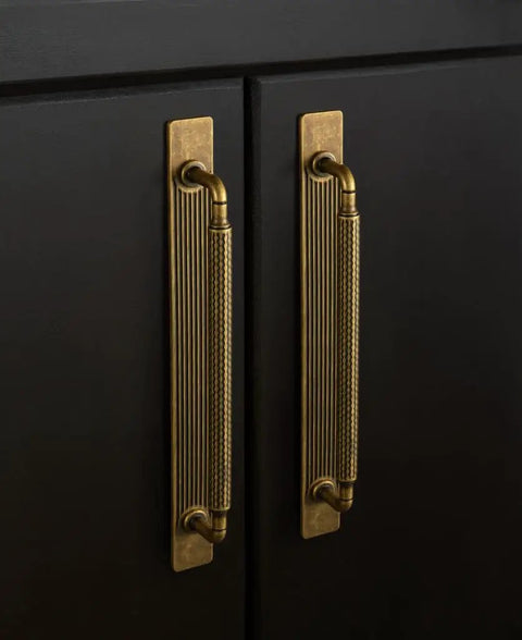 Antique Brass Cabinet Pulls With Backplates, Solid Zinc Alloy Kitchen Drawer Hardware, Crest Wave Plate Style on black cabinetry.
