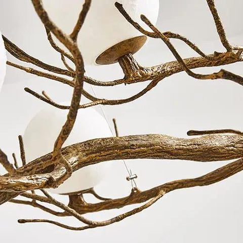 Close-up view of Branch Design Ceiling Pendant Light Vintage Moon Art Chandelier 9 Light Array with gold branches and white globes.