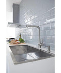 Cosmopolitan Stainless Steel Soap Dispenser With InfinityFinish Top Refill Brass Head And Flange 15 oz in modern kitchen