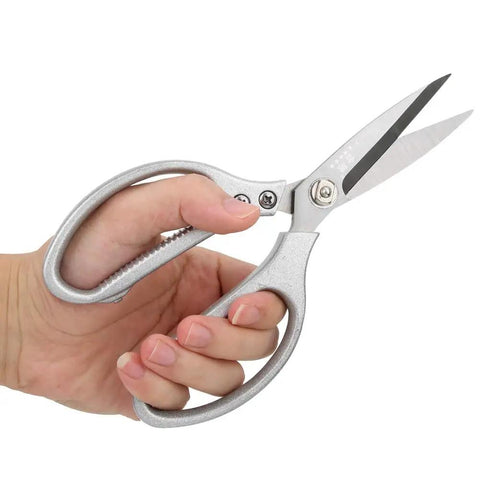 Hand holding Heavy Duty 8.5 Inch Stainless Steel Scissors With Aluminum Alloy Handle For Kitchen Fabric Paper Plants And Everyday Cutting Tasks.