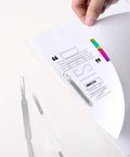 Heavy Duty Self Adhesive Ring Binders With Solid Steel Fasteners holding paper in a folder, showcasing peel stick design for organization.