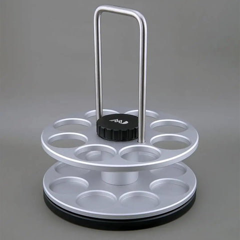 Eight Single Dose Espresso Bean Storage Tubes With Rotating Display Rack And Precision Funnel Set showing rotating rack with handle.