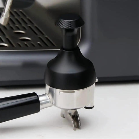 Upgrade Your Daily Brew Routine With This Dope Adjustable Espresso Coffee Tamper And Premium Needle Distributor Leveler Compatible With Most 58Mm Portafilters showing black tamper on silver portafilter.