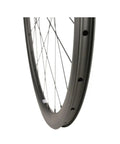 Close-up of Carbon Fiber 38mm 700c Disc Brake Road Bike Wheelset Clincher Tubeless Ready with MT075 Hub and 24 Hole Spokes