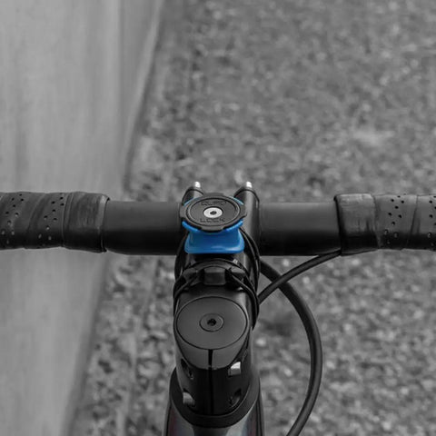 Bike Handlebar And Stem Phone Mount Kit With MAG Universal Adapter And Dual Lock attached to bike, top-down view.