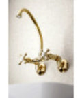 Gold two-handle wall-mount kitchen faucet with curved spout and cross handles
