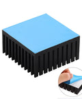 4 Pack Black Aluminum Heat Sinks With Pre Applied Thermal Conductive Tape, shown with blue tape layer being peeled off.