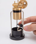 Retro Three Legged Oscillating Steam Engine Model Kit showing brass boiler with hand adjusting wick in base