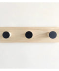 Reliable Wall Mounted Coat Rack Featuring Charming Crown Hooks That Hit Different In Kids Rooms While Keeping Coats Robes Bags And Towels Cleanly Organized Daily - wooden panel with three black hooks