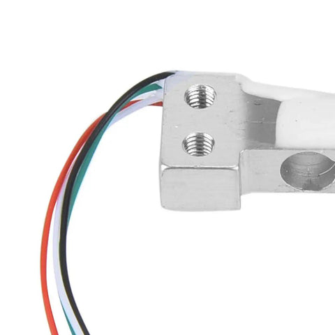 Close-up of 0 to 100 gram parallel beam load cell sensor with aluminum alloy build for tiny scales, showing connecting wires.
