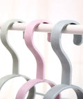 Fan Shaped Closet Rod Organizer For Ties Scarves And Hats Made From Sturdy Polypropylene, showing three colors on a rod.