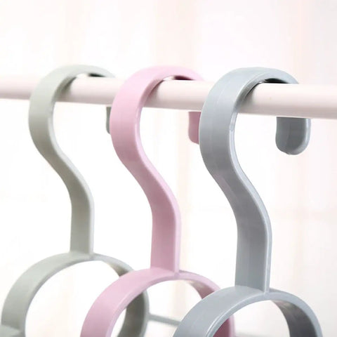 Fan Shaped Closet Rod Organizer For Ties Scarves And Hats Made From Sturdy Polypropylene, showing three colors on a rod.