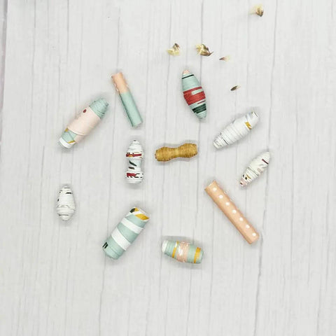 Large Paper Beads Maker Dies And Stencils For DIY Scrapbooking And Card Making, showcasing colorful paper beads on a wood table.