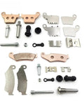 Premium Motorcycle Front And Rear Brake Caliper Repair Kit With Pins, Springs And Pads For Off Road Dirt Bikes, Delivers Strong Braking, Easy Fit, Durable Construction, Ideal Upgrade For Caliper Maintenance And Braking Stability. brake parts laid out on white background
