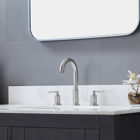 Widespread 3 Hole Bathroom Faucet Kit In Brushed Nickel, 8 Inch Spread, Two Handle Vanity Faucet on white sink in modern bath.