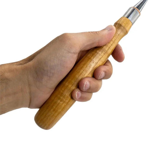 Hand holding Heavy Duty Chrome Vanadium Paring Chisel With Cryogenic Treated Edge and Long Comfort Grip for wood carving.