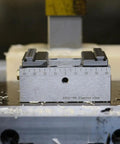 Rock Solid Self Centering CNC Vise Tailored For 4 And 5 Axis Milling with precision markings and heavy gauge steel.