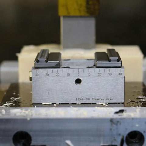 Rock Solid Self Centering CNC Vise Tailored For 4 And 5 Axis Milling with precision markings and heavy gauge steel.