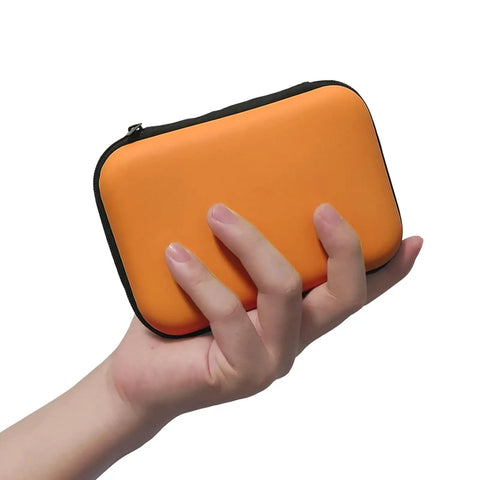 Beefed Up Snake Bite Kit With Venom Extractor Suction Pump For Humans And Pets in portable orange case held in a hand