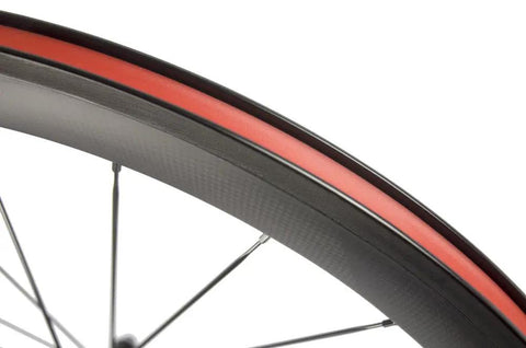 Close-up of Toray T700 Carbon Fiber 50mm Clincher Wheelset for 700C Road Bikes With 23mm Wide Rim Deep Section 3K Red and White 3D Decal