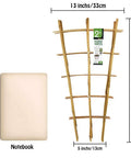 Sturdy Bamboo Garden Trellis Set Of 3, 24 Inch Tall Ladder Style Plant Support next to notebook for scale