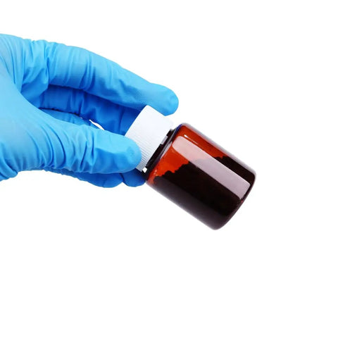 Pro Grade WS2 Tungsten Disulfide Powder For Lubrication bottle held by gloved hand