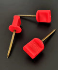 Close-up of 20Pack Archery Target Pins heavy duty manganese steel nails with red plastic heads on black background