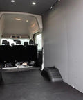 Interior view of a van featuring Gray Van Wall Liner Panel Insulated Polypropylene With Foam And Foil Core Direct OE Match.