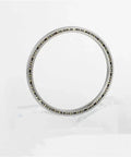 Tough As Nails Heavy Duty Precision Needle Roller Bearing 1.5 Bore 1.875 Outside 0.1875 Width, showing a round roller bearing design for industrial use.