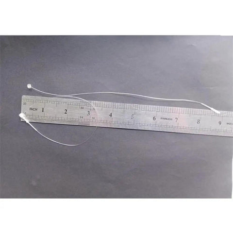 1000 Pc Clear 9 Inch Plastic Hang Tag Fasteners No Sweat Quick Snap Lock Security Loops with ruler for size reference.