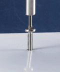 Premium Heavy Duty Size 12 X 2 Inch Flat Head Tek Screws 100 Pack 410 Stainless Steel in use with Allen drive on white surface.