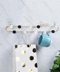 Gotta Have These Killer Wrought Iron Love Wall Hooks For Keys Hats And Scarves With A Totally Dope European Touch Black Metal Row Bar For Your Entryway Flex Size 39X8cm hanging a blue mug and a bag.