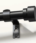 Close-up of Built To Last Black Curtain Rod Set For Windows 48 To 84 Inches Adjustable 1 Inch Diameter With Decorative Finials.
