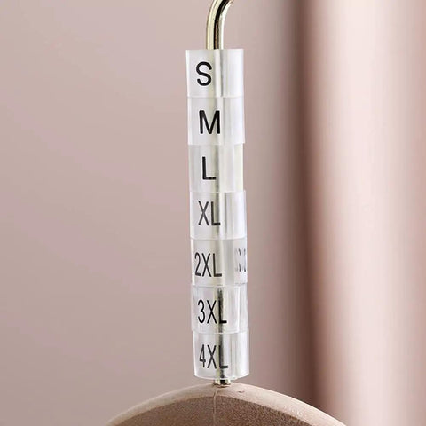 Plastic Clothes Hanger Size Markers Kit With 7 Size Range XS To 3XL showing sizes S to 4XL on a wire hanger
