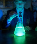 Students conducting science experiment with glowing liquid from 6 Grams Luminol Powder For 16 Oz Solution Lab Grade High Purity