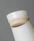 Close-up of the lid detail of a Premium Ceramic Sealed Tea Canister And Hermetic Food Storage Jar For Pantry Organization.